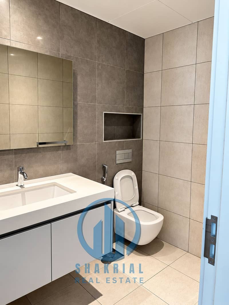 10 Modern Minimalist Grey and Beige Bathroom. png