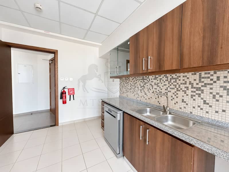 14 Bright Modern Kitchenette with Fire Blanket. png