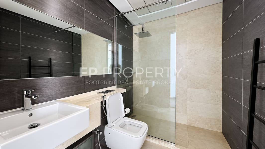 9 Modern Minimalist Bathroom with Glass Shower. png