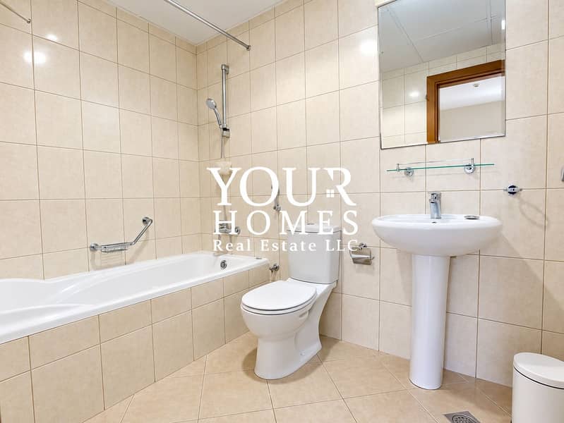 5 Modern Beige-Tiled Bathroom with Watermark. png