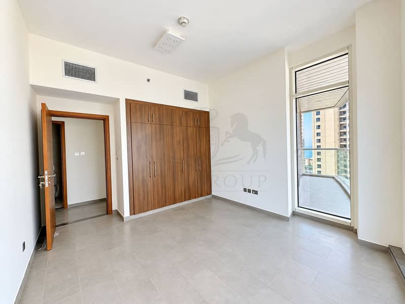 8 Bright Modern Bedroom with City Balcony View. png