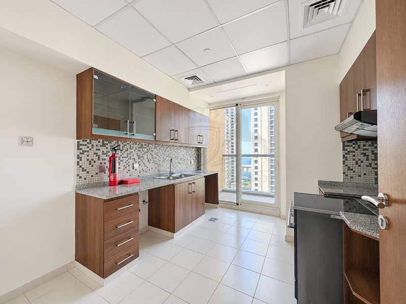 12 Bright Modern Kitchen with Balcony View. png