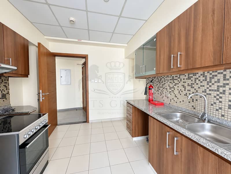 15 Modern Kitchen with Open Hallway Door. png