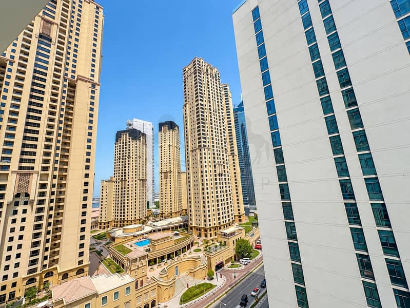 18 Sunlit Dubai High-Rise Courtyard Skyline. png