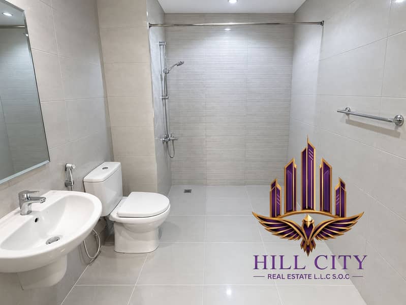 6 Modern Minimalist Grey-Tiled Bathroom. png
