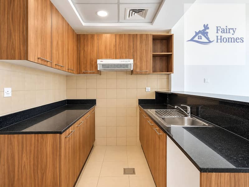 6 Modern Warm-Wood U-Shaped Kitchen. png