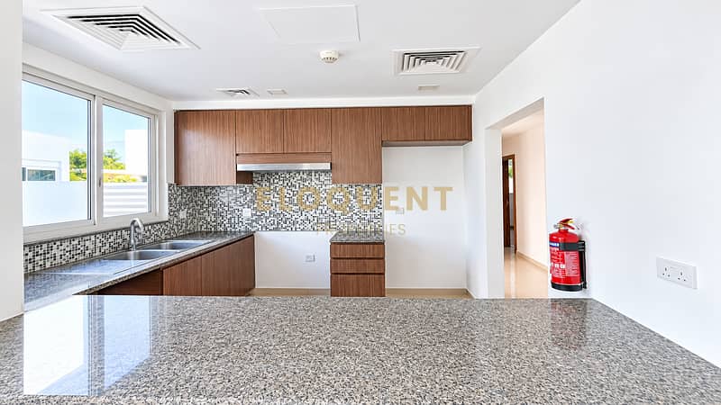 4 Bright Modern Kitchen with Granite Island. png