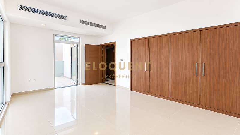 9 Bright Minimalist Room with Wood Wardrobe. png
