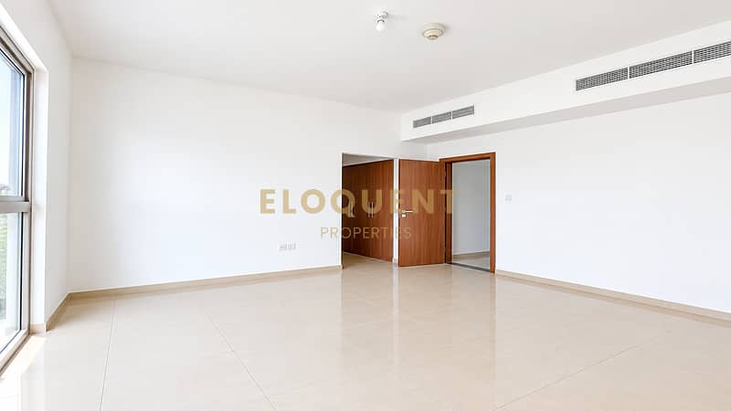 12 Bright Minimalist Room with Wooden Door. png