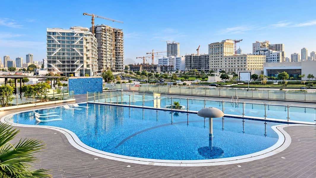 9 Rooftop Pool Overlooking a Growing Skyline. png