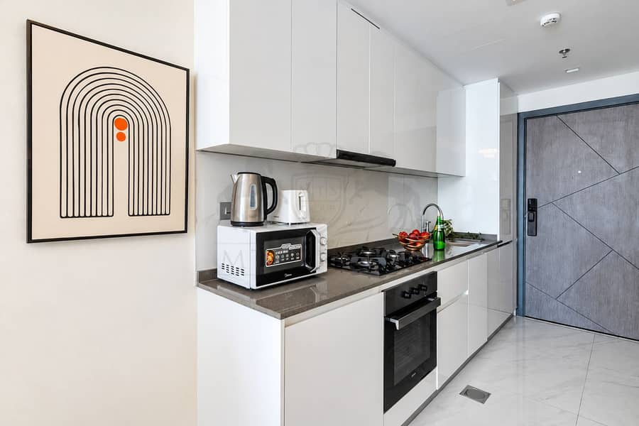 14 Modern Minimalist Kitchenette with Bold Arch Artwork. png
