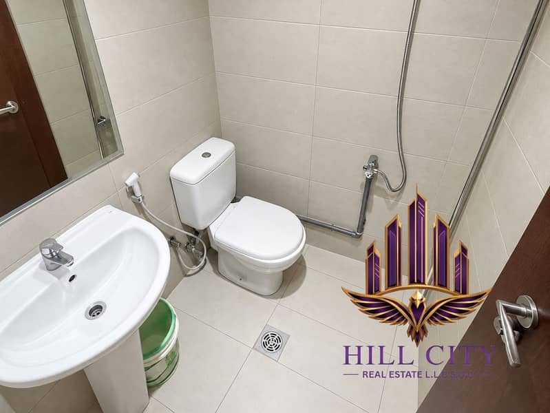 4 Clean Modern Beige-Tiled Bathroom (1). png