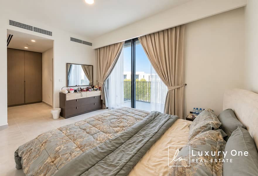 6 Modern Neutral Bedroom with Balcony View. png