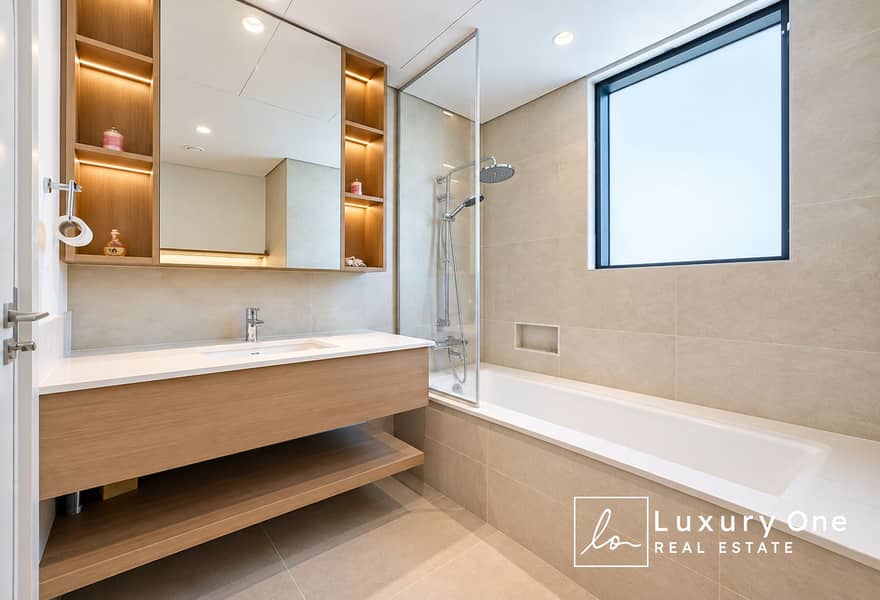 11 Modern Minimalist Bathroom with Warm Wood Accents. png