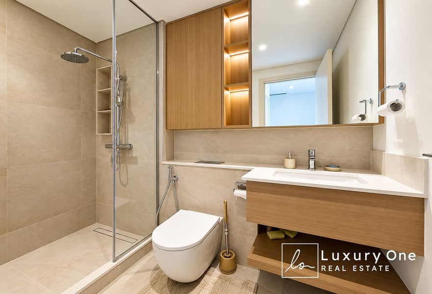 13 Modern Beige Bathroom with Walk-In Shower. png