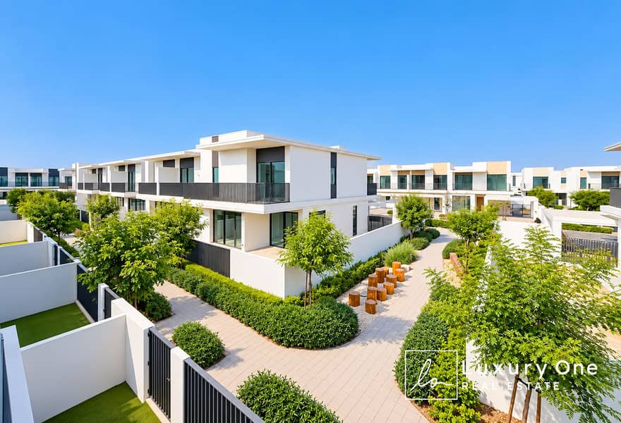 14 Modern Villas Along a Garden Walkway. png