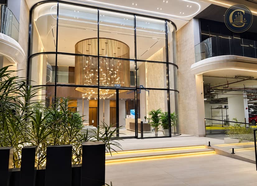 30 Curved Glass Lobby at Twilight. png