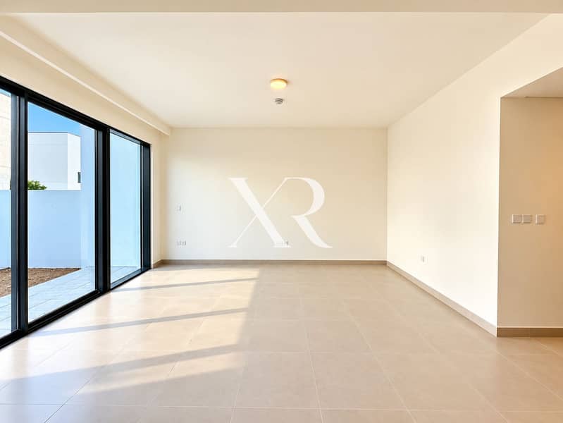 7 Sunlit Minimalist Room with Glass Doors. png