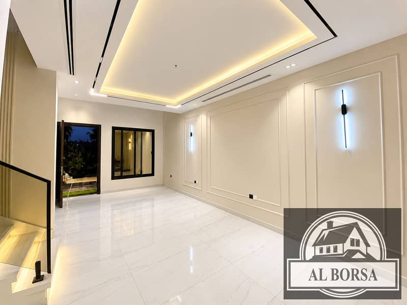 2 Modern Minimalist Living Room with Dramatic Lighting. png