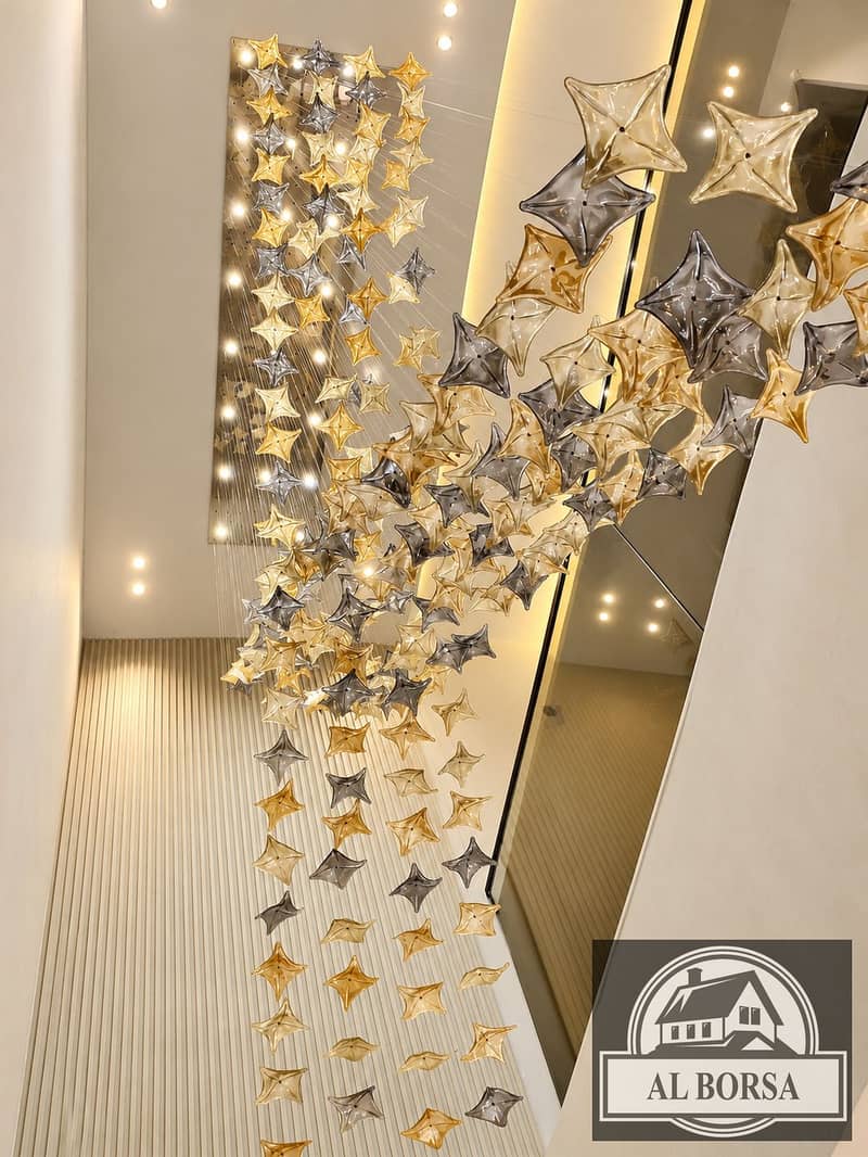 4 Cascading Star Chandelier in a Modern Foyer. png
