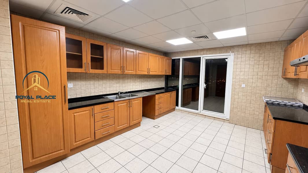 13 Modern Warm-Toned Kitchen at Night. png
