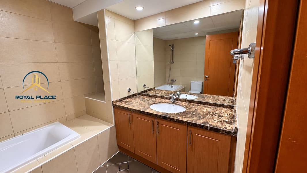 16 Elegant Beige-Tiled Bathroom Interior. png
