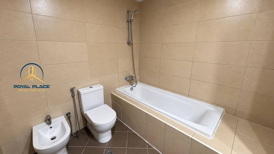 17 Modern Beige Tiled Bathroom. png
