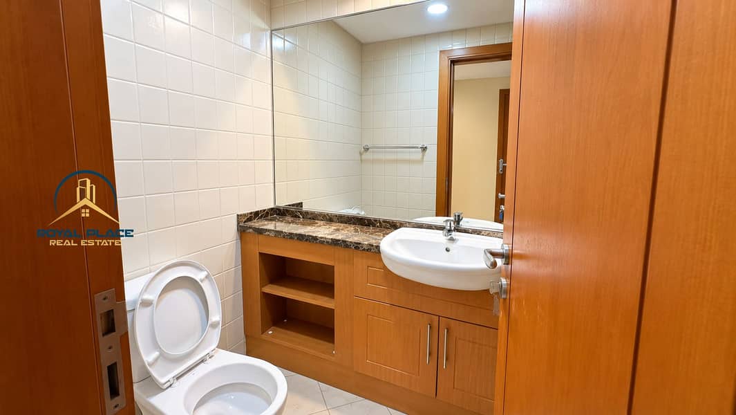 18 Modern Tiled Bathroom with Wooden Vanity. png