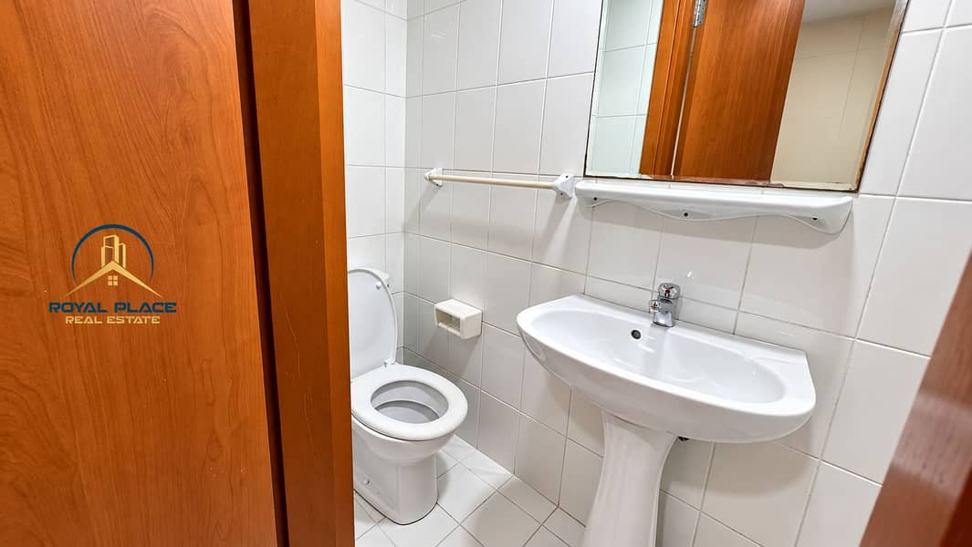 21 Clean White-Tiled Powder Room. png