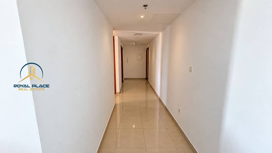 6 Minimalist White Hallway with Warm Lighting. png