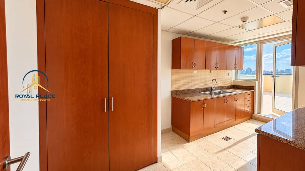 8 Sunlit Modern Kitchen with City Views. png