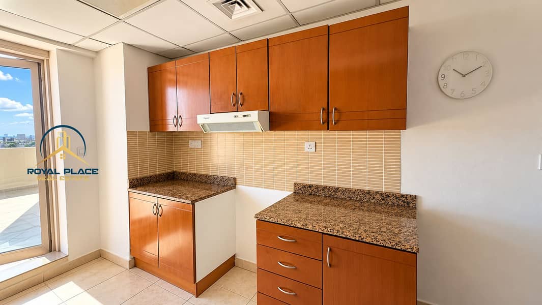 10 Modern Sunlit Kitchen with Balcony View. png