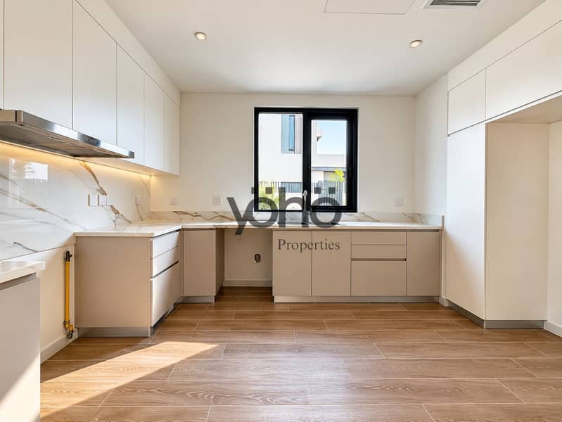 3 Bright Minimalist Kitchen with Marble Details. png