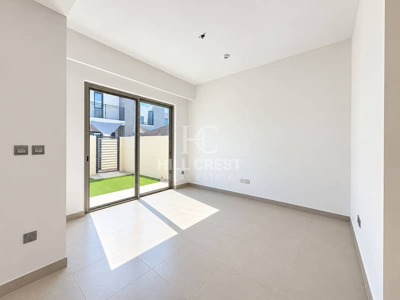 3 Sunlit Minimalist Room with Patio Views. png