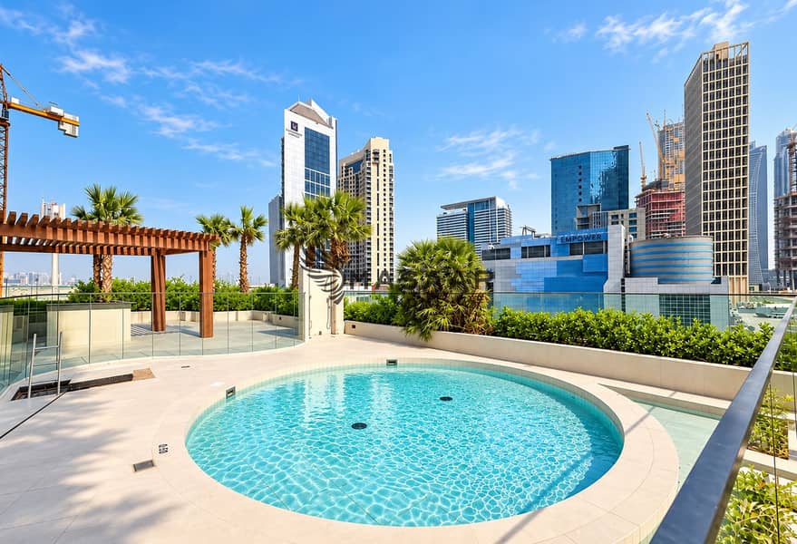 8 Rooftop Pool Overlooking the City Skyline. png