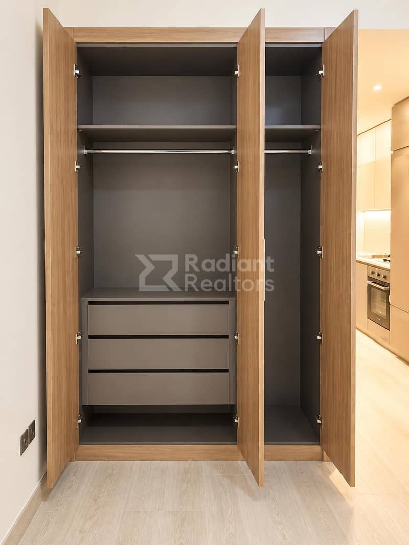 6 Modern Walnut Wardrobe in Minimalist Interior. jpg