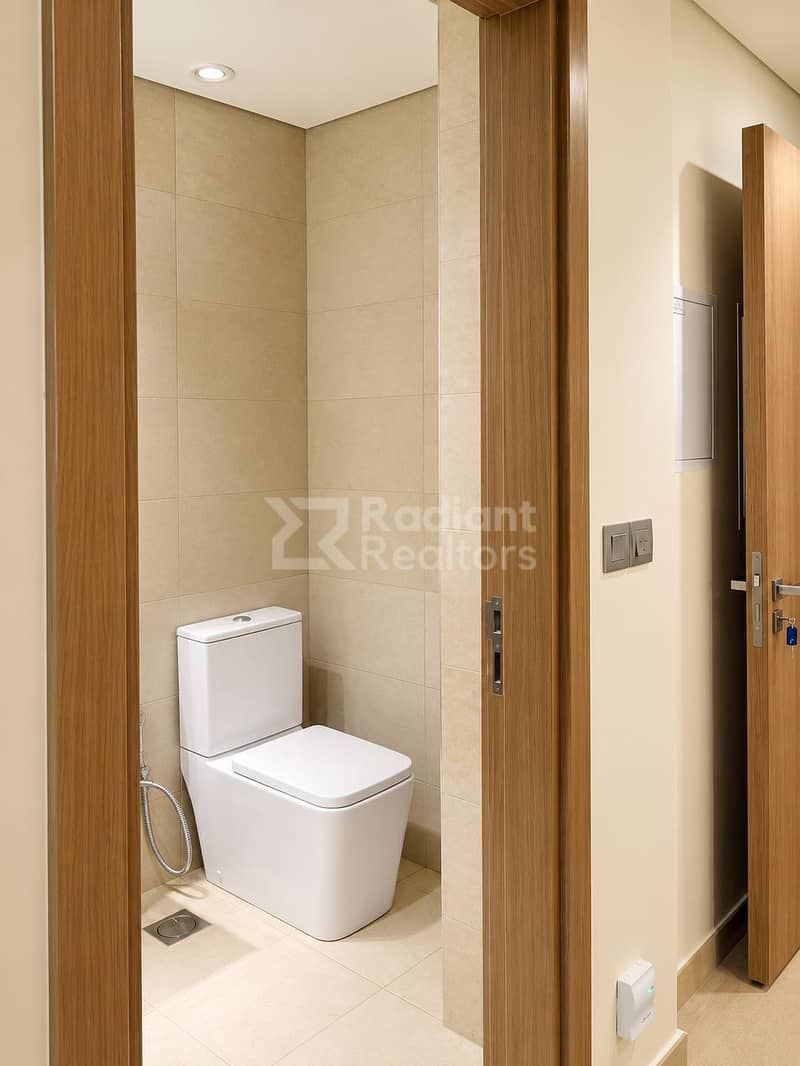 7 Minimalist Beige-Tiled Guest Bathroom. jpg