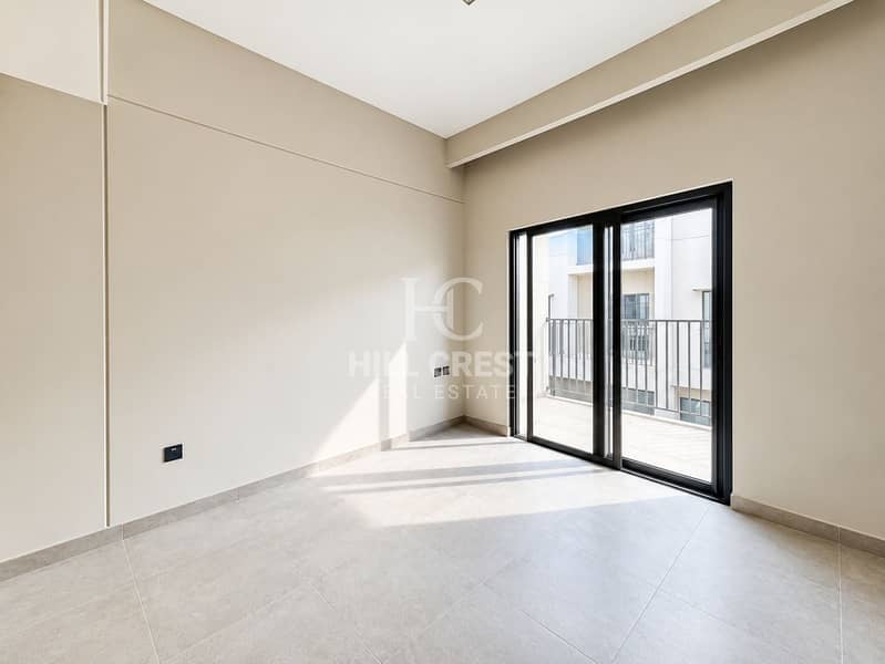 31 Sunlit Minimalist Room with Balcony Views. png