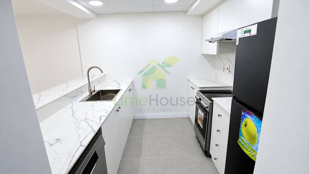 7 06-dubai-the-greens-al-arta-4-1br-apartment-kitchen-appliances. jpg