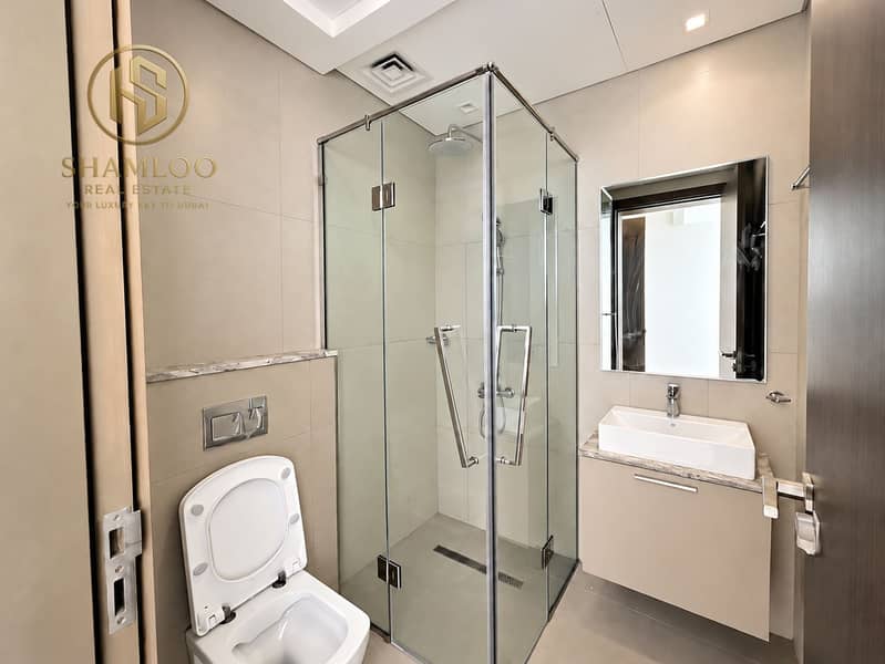 8 Modern Minimalist Bathroom with Glass Shower. png