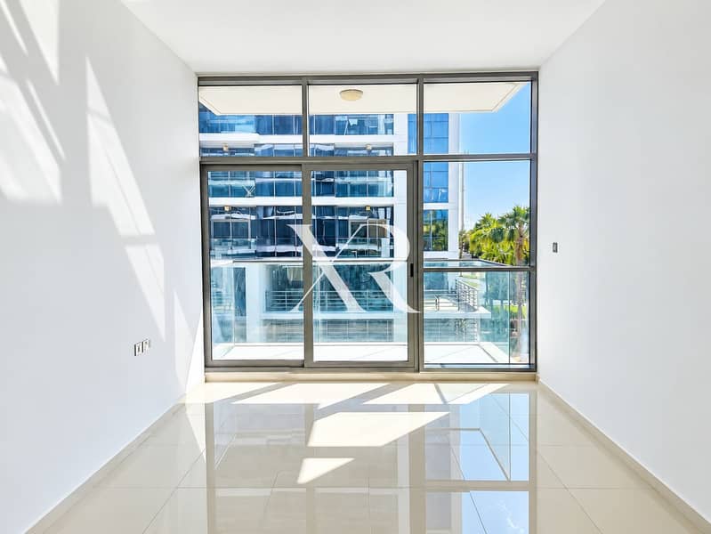2 Sunlit Modern Room with Glass Balcony Views. png