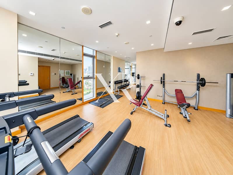 7 Bright Modern Gym with Mirrors and Treadmills. png