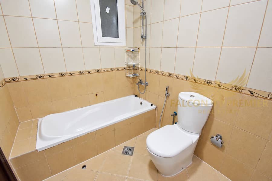 12 Beige tiled bathroom with dark wood-2. png