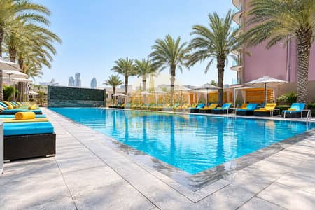 Studio for Sale in Jumeirah Village Circle (JVC), Dubai - Luxurious Tropical Resort Poolscape. png