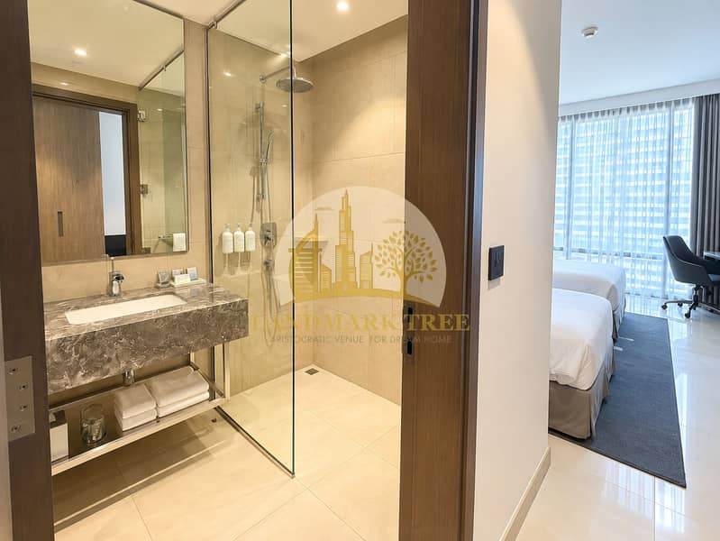 4 Modern Hotel Bathroom with Bedroom View. png