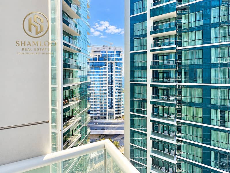 12 Sunlit Urban Balcony Between Glass Towers. png