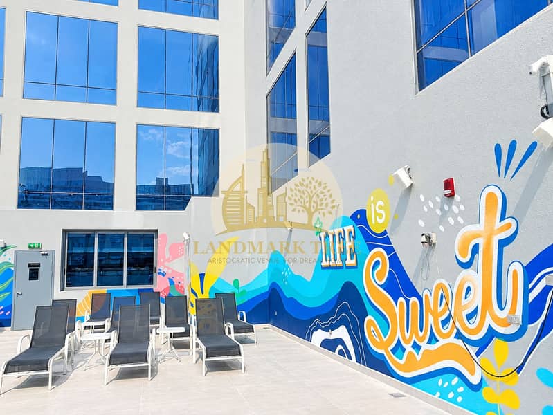 5 Sunny Courtyard with Life Is Sweet Mural. png