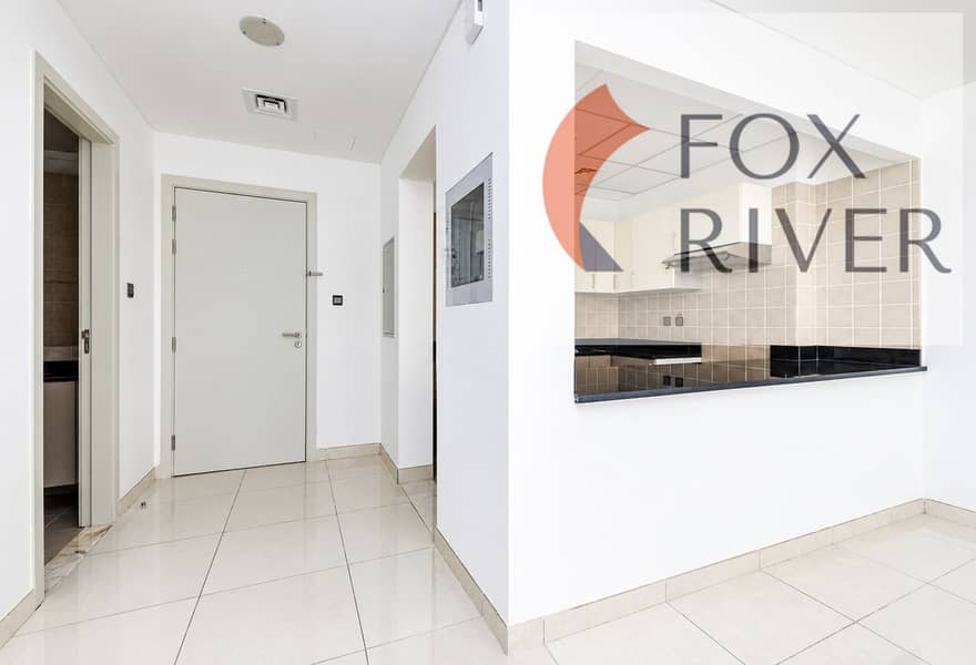 2 Bright Minimalist Apartment Hallway and Kitchen. png