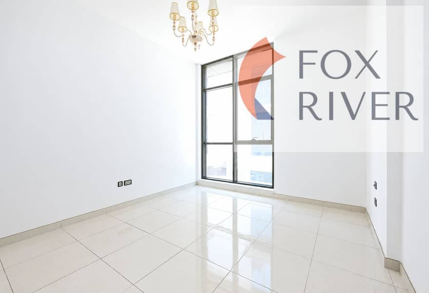 4 Bright Minimalist Room with Chandelier and City Window. png