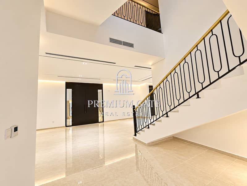 10 Modern Marble Foyer with Sculptural Staircase. png